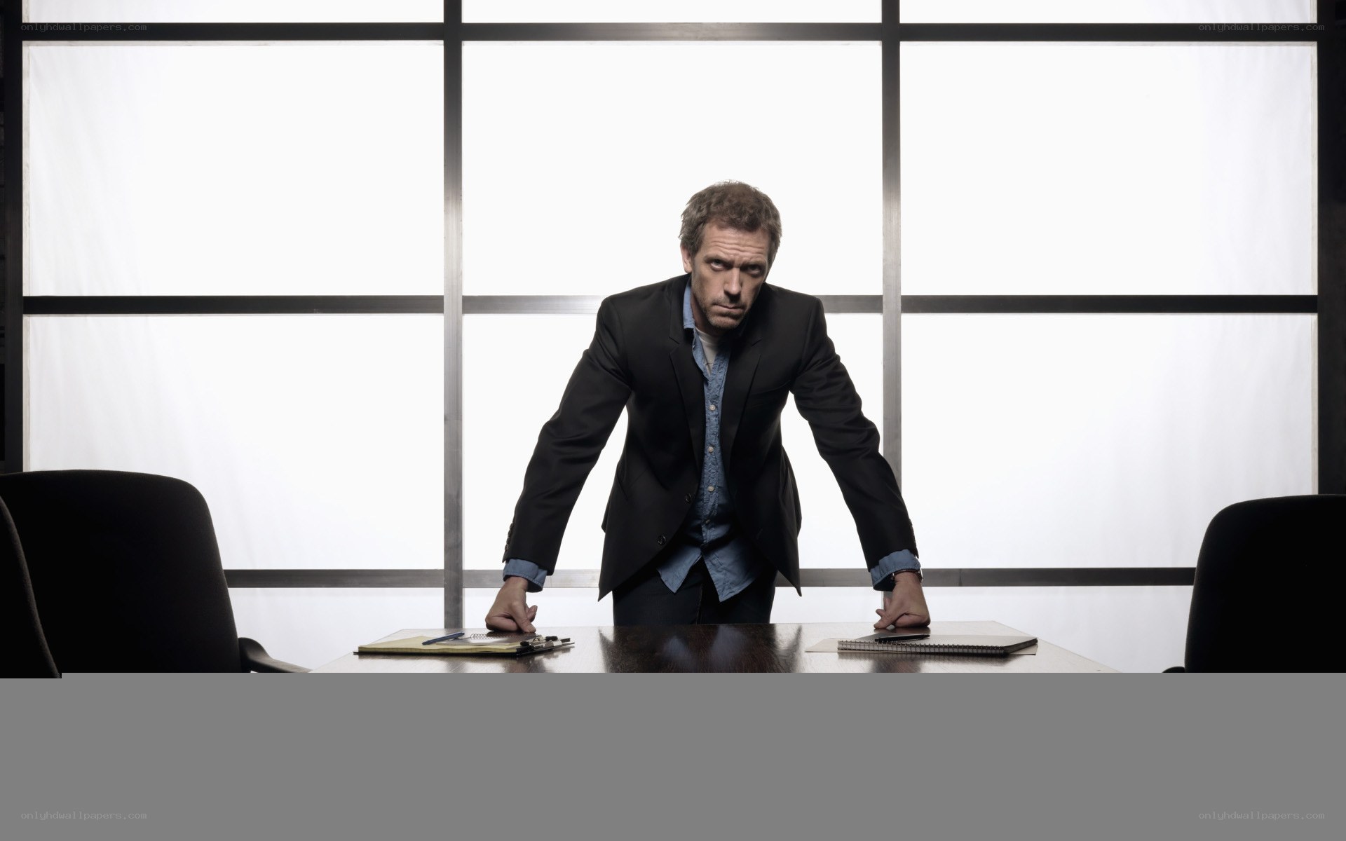 man in suit at conference table