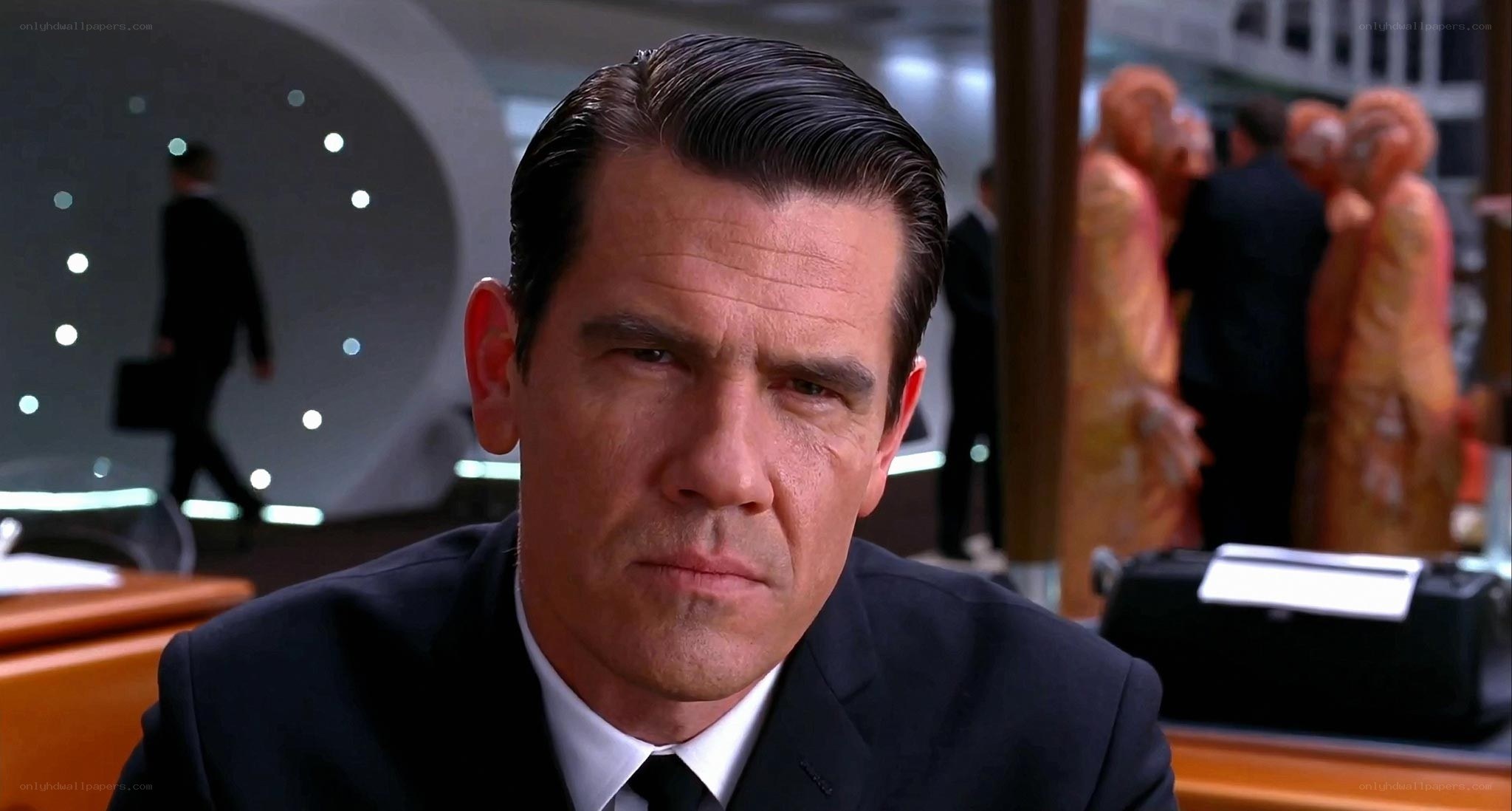 man in suit at desk