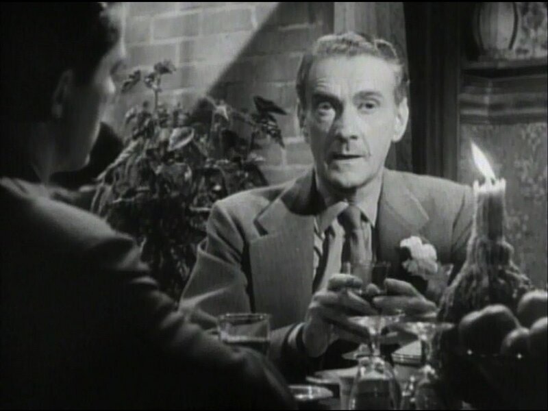 Man in Suit at Dinner Table — Black