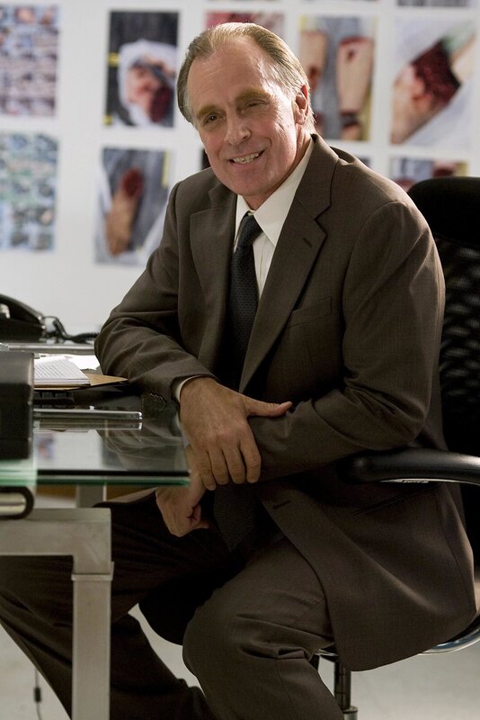 Man in suit at office desk