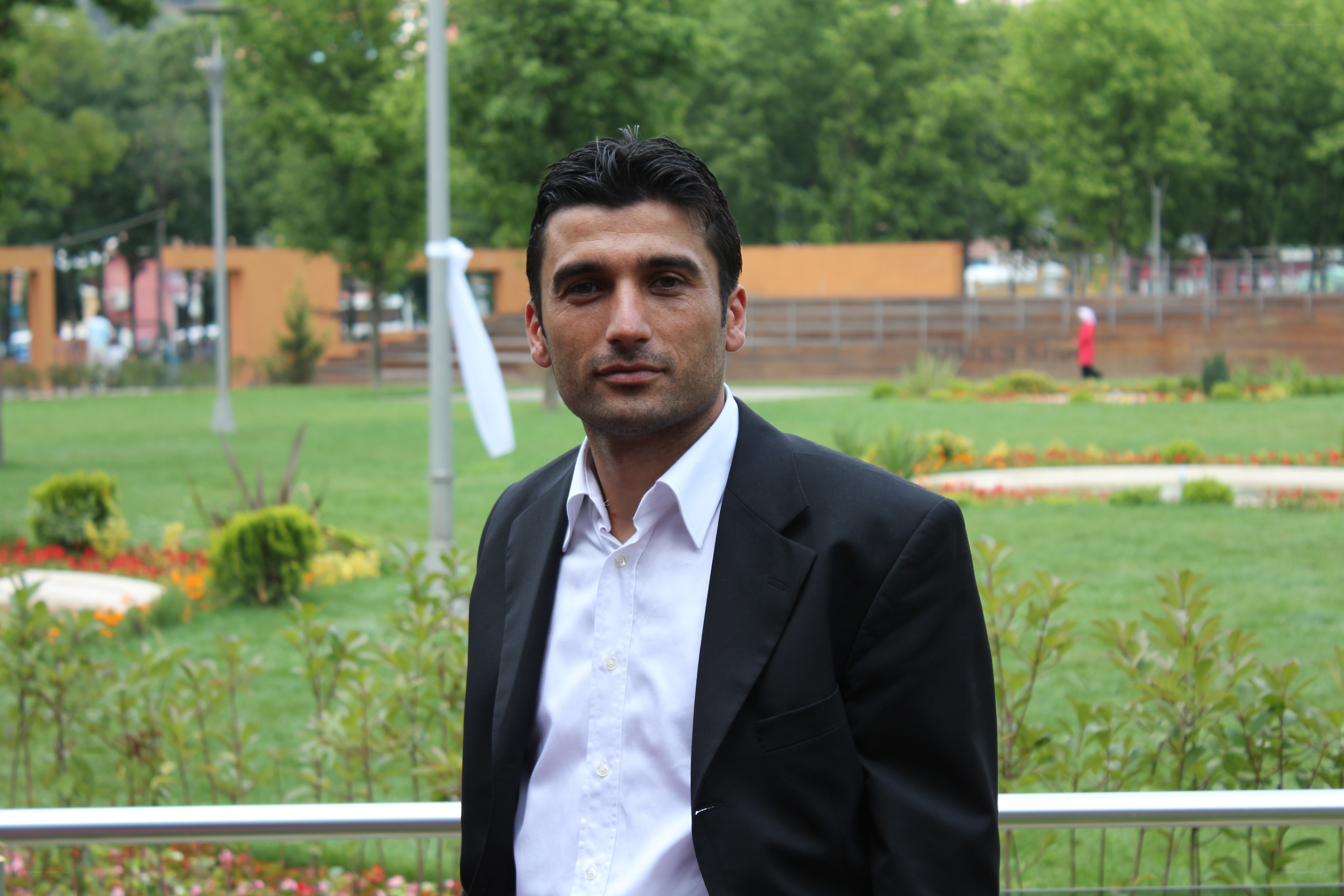 man in suit at park