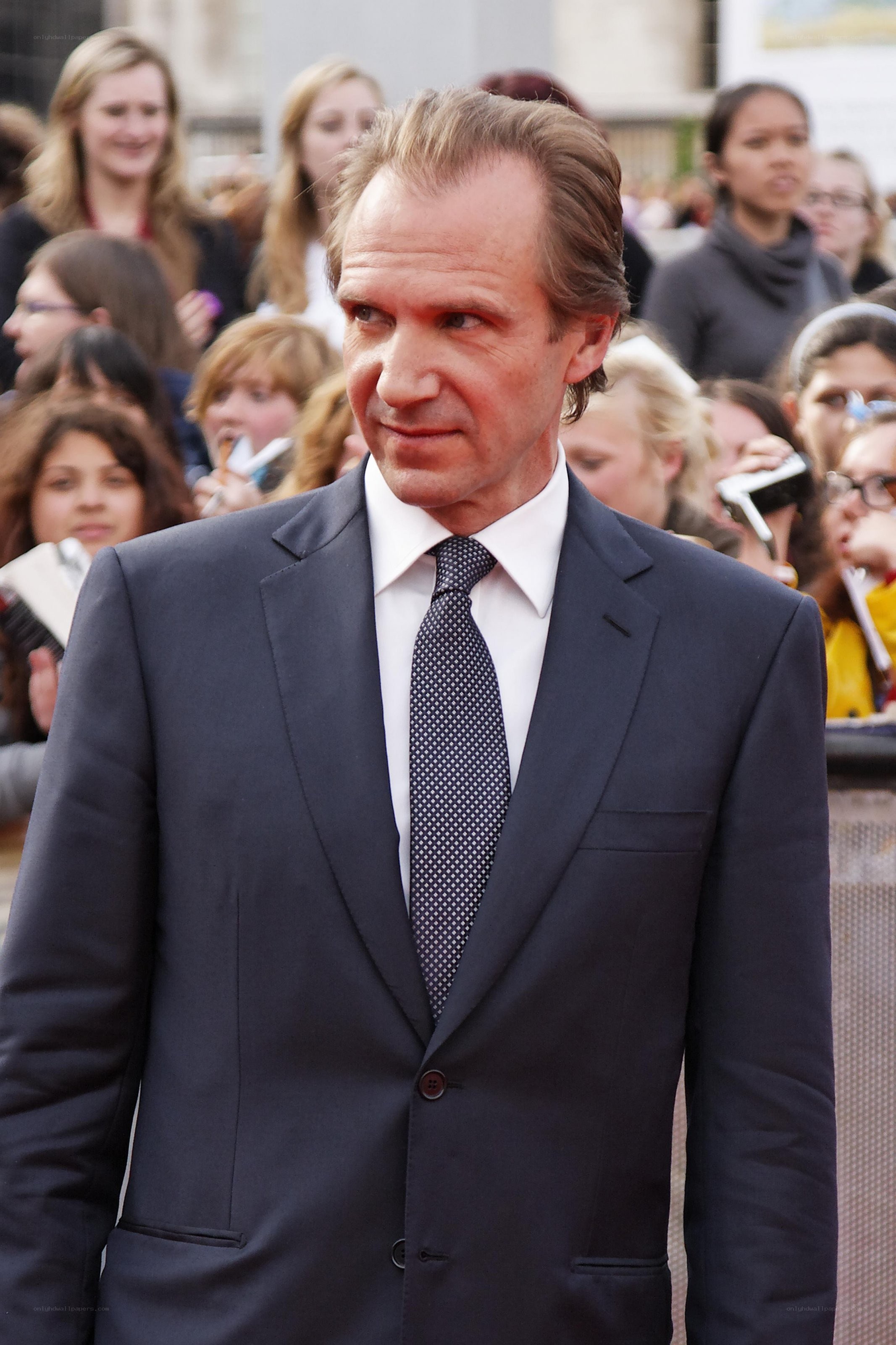 man in suit at public event
