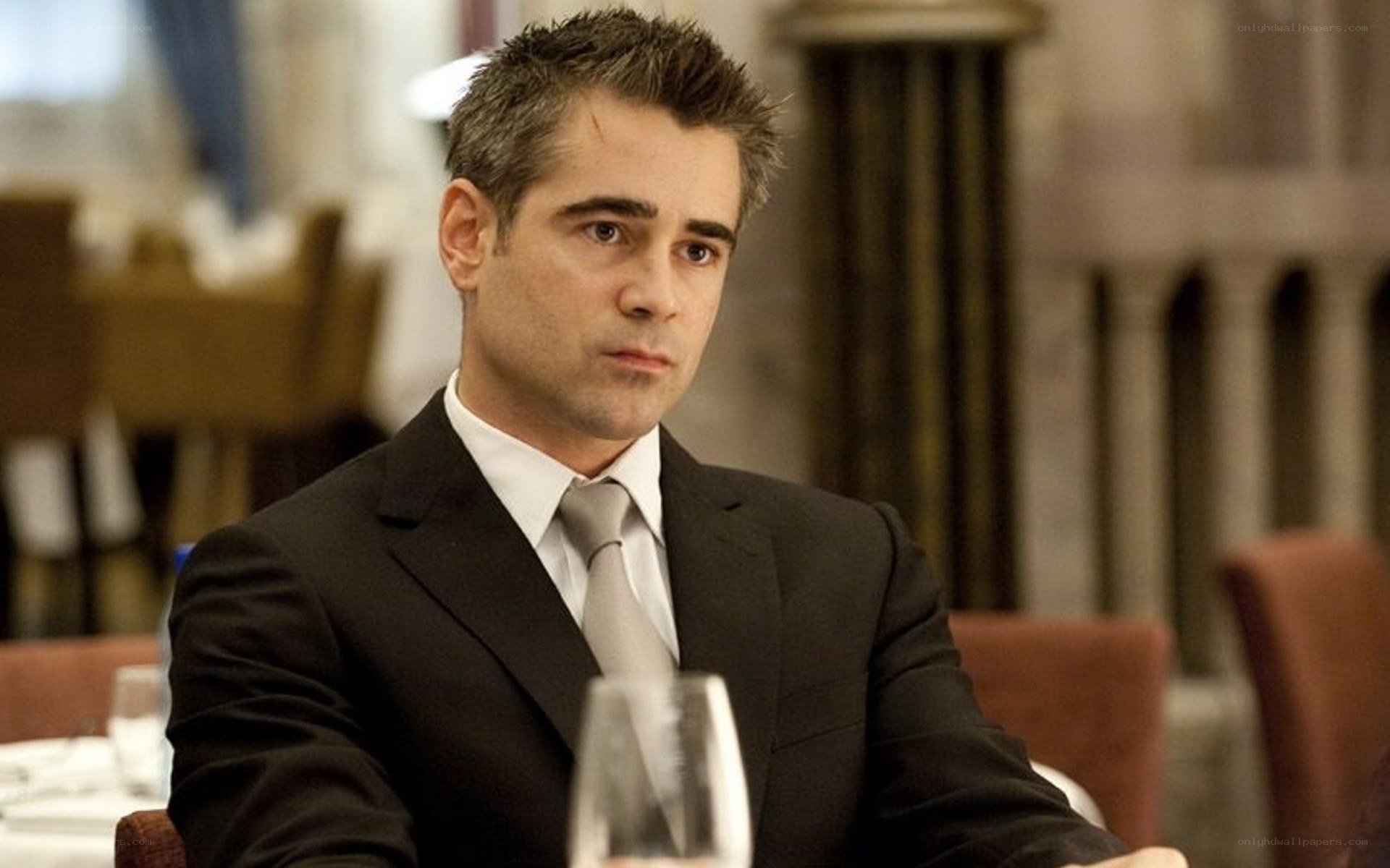 man in suit at restaurant