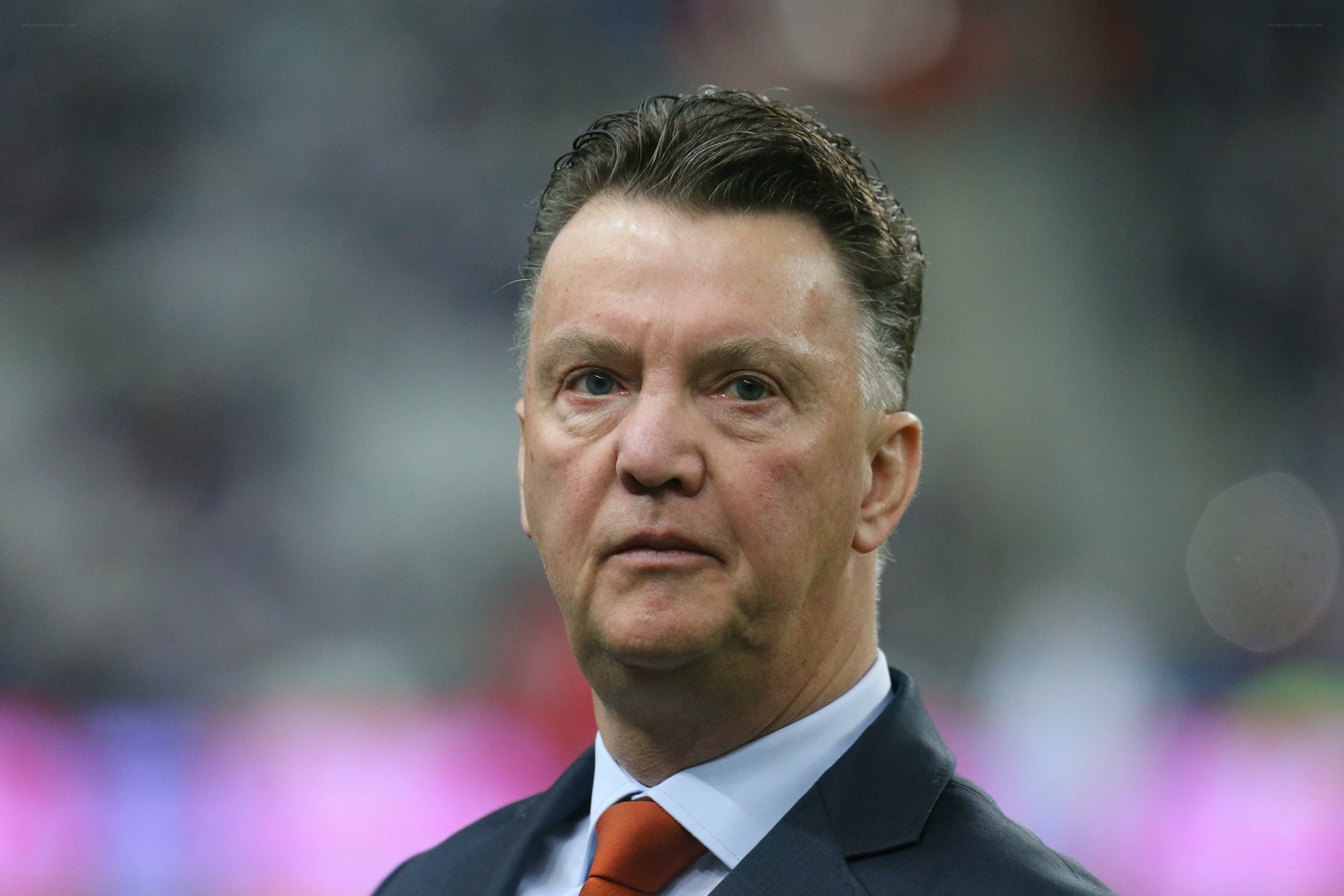 man in suit at stadium