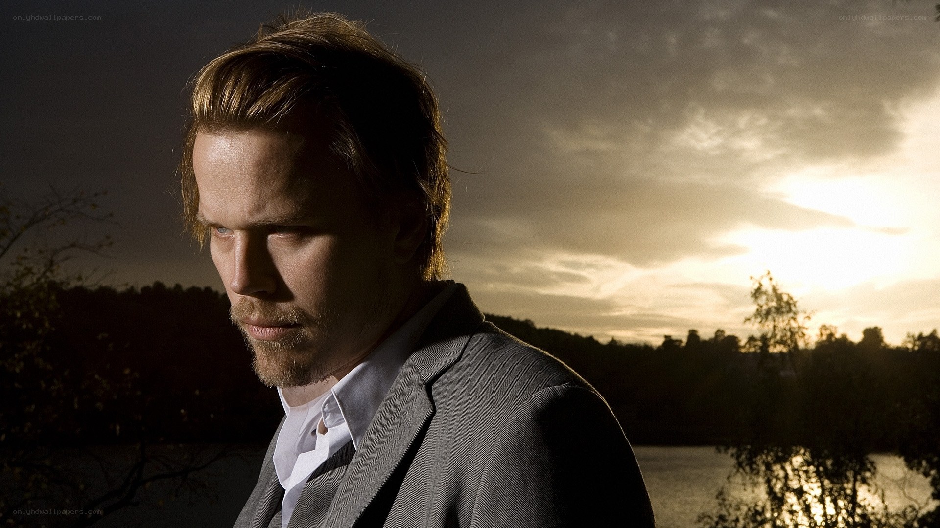 man in suit at sunset
