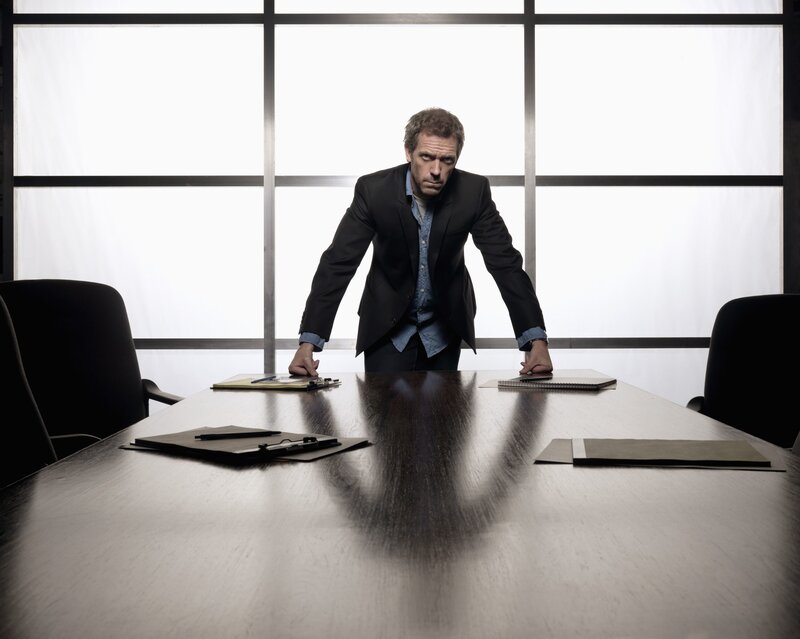 Man in Suit at Table — Black