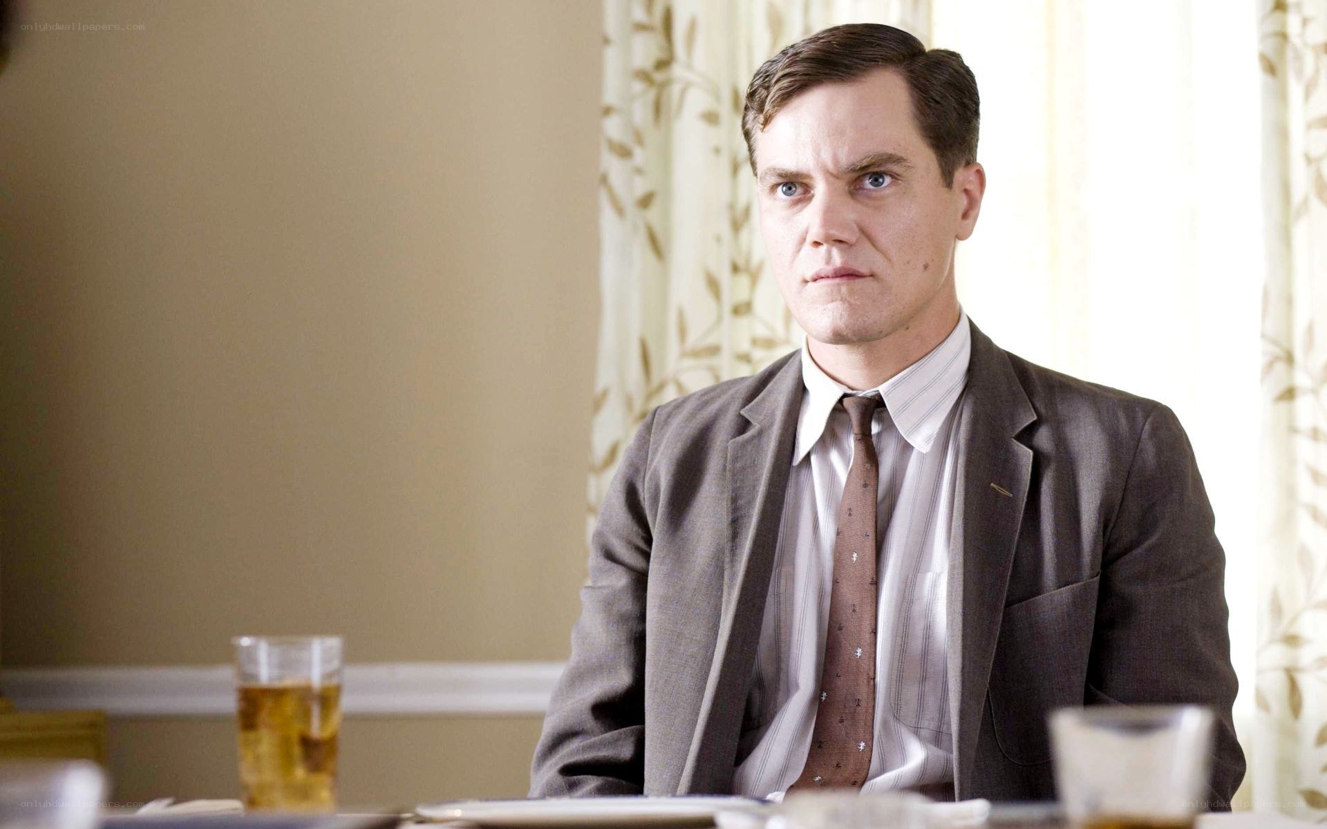 man in suit at table