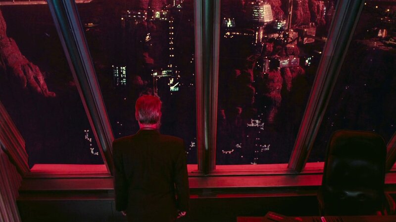 man in suit at window