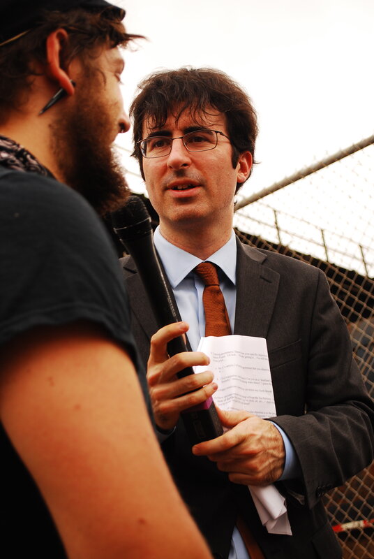 Man in suit being interviewed