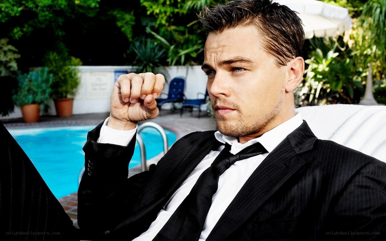 man in suit by pool