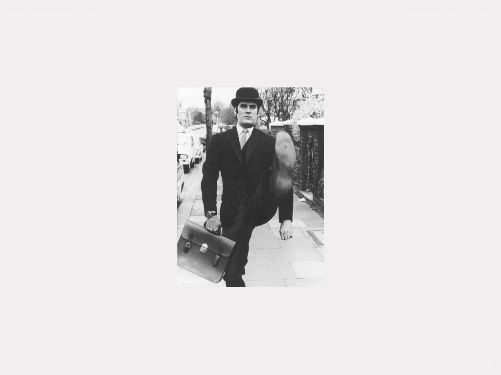man in suit carrying briefcase