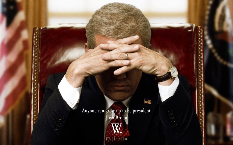 Man in Suit Covering Face