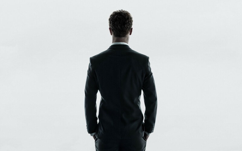 man in suit from behind