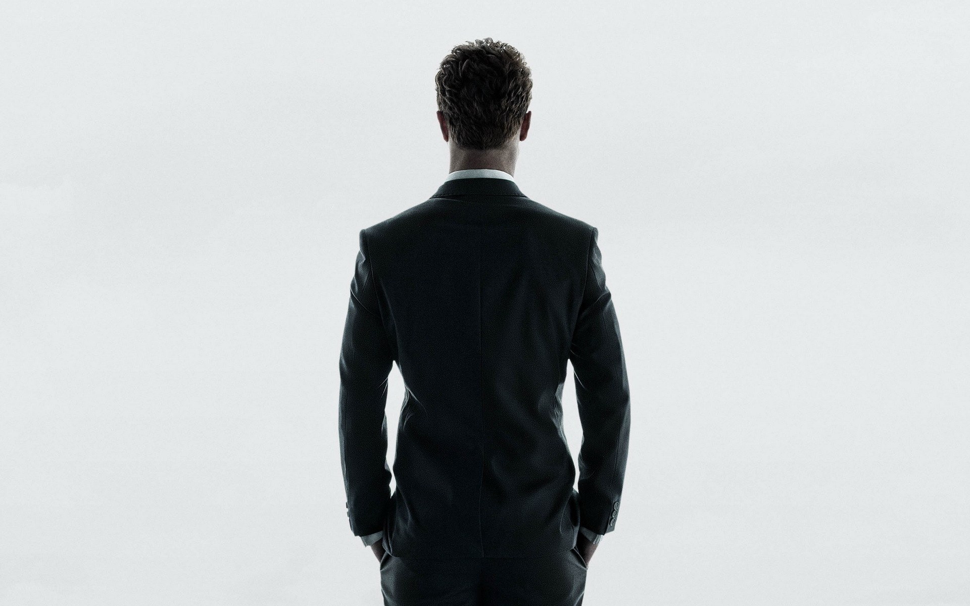 man in suit from behind