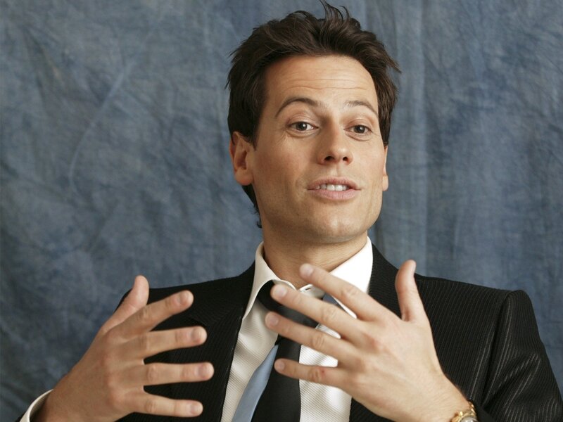 man in suit gesturing