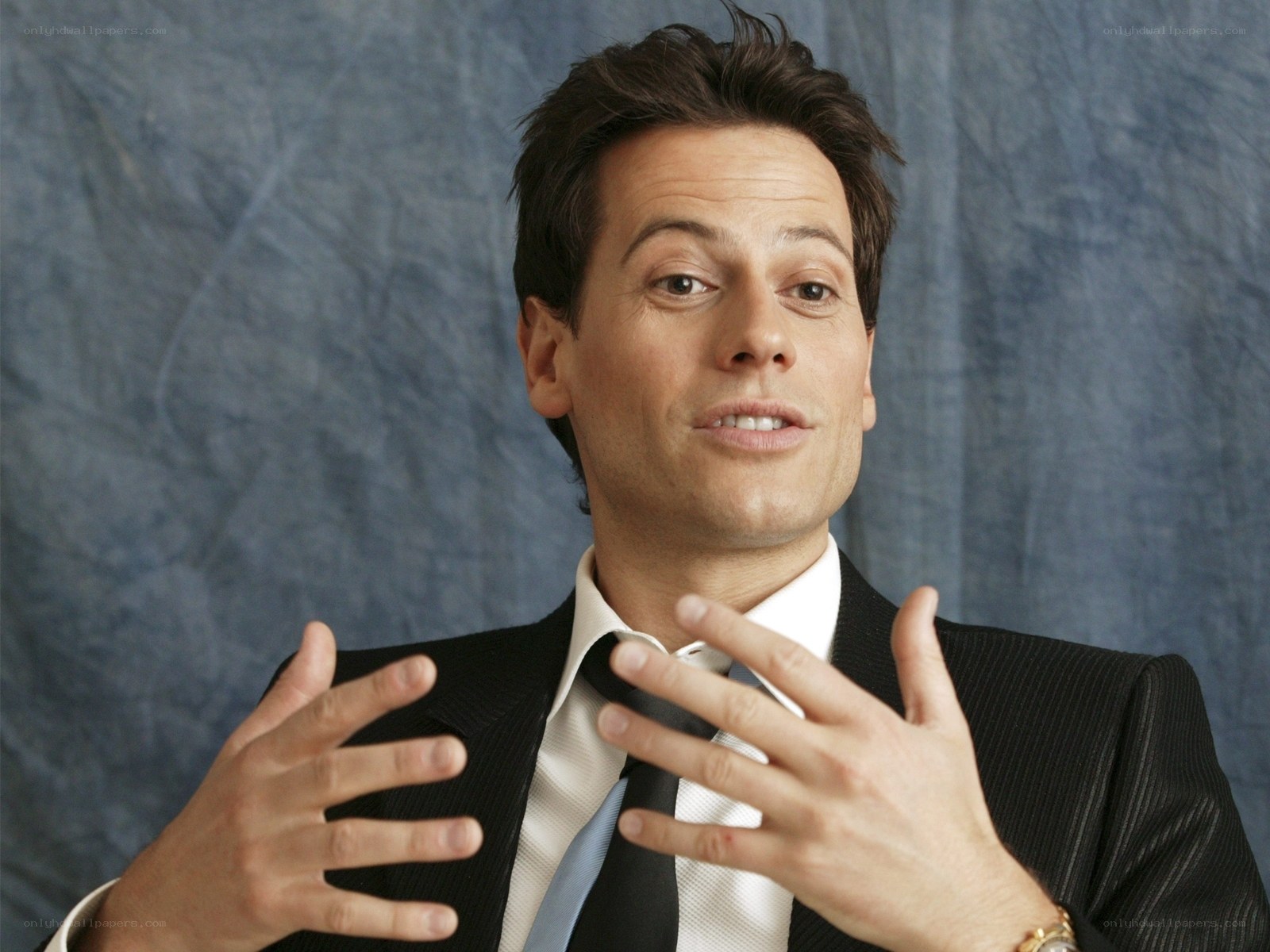 man in suit gesturing