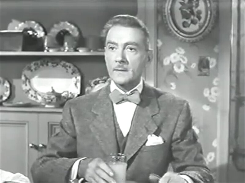 Man in Suit Holding Glass — Black