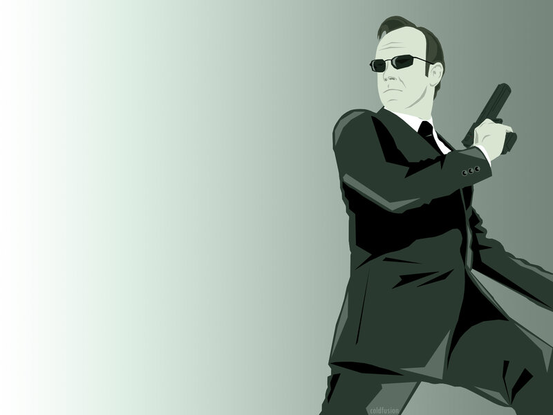 man in suit holding gun
