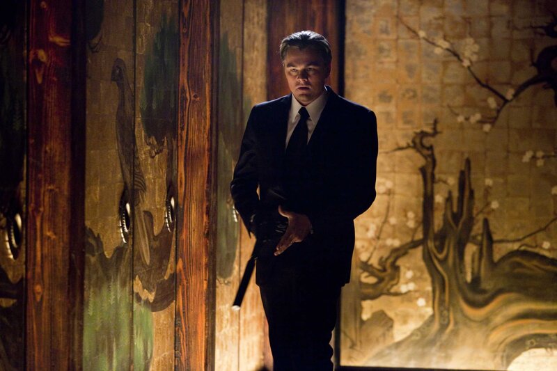 man in suit holding gun