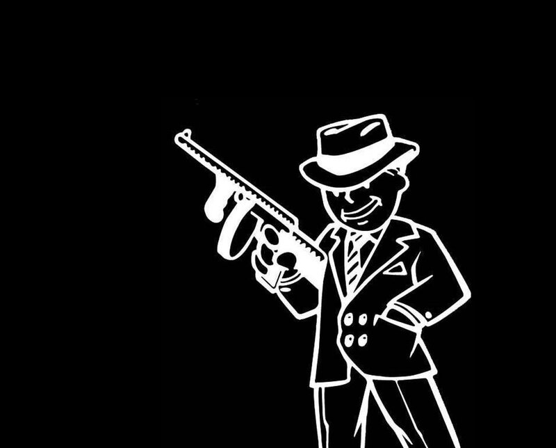 man in suit holding gun