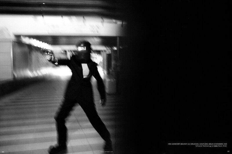 Man in suit holding gun