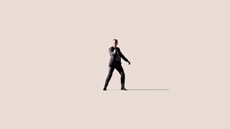 Man in Suit Holding Gun — Beige