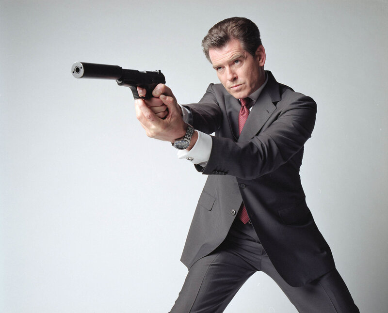 Man in Suit Holding Gun — Gray, Serious, Photograph, Tie, Black, White