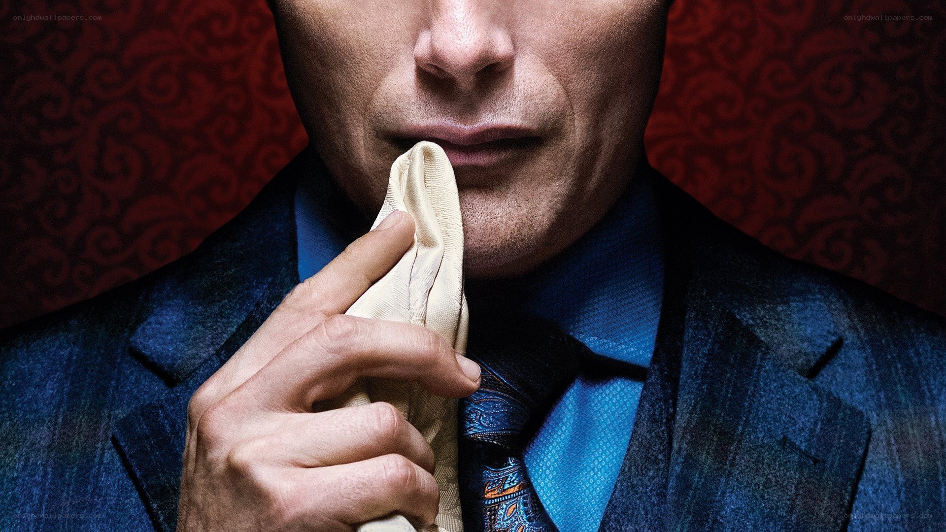 man in suit holding handkerchief