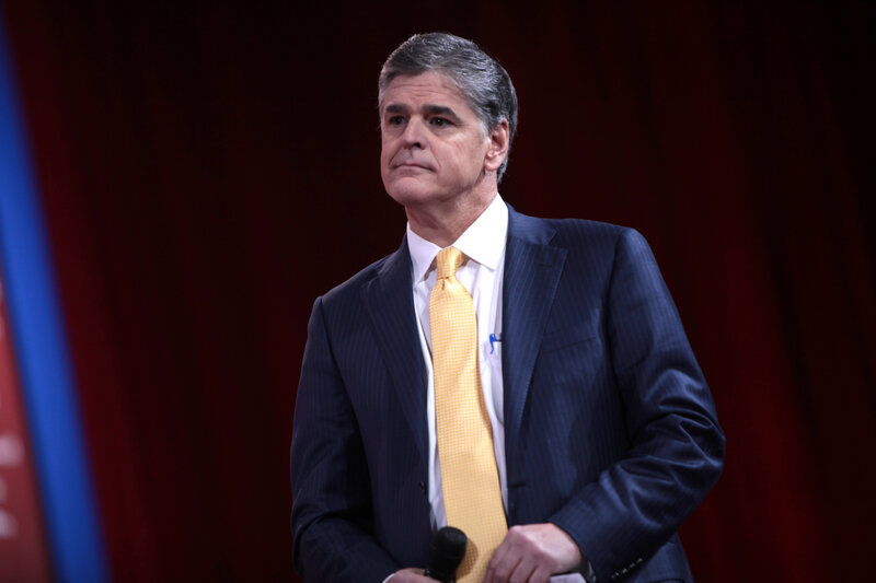 Man in Suit Holding Microphone — Blue