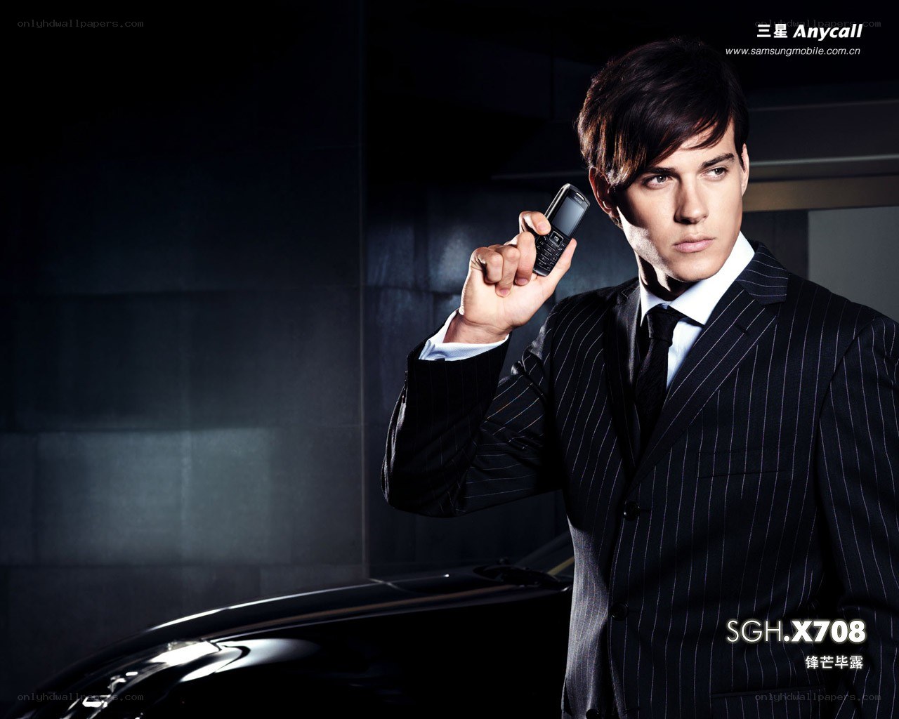 Man in suit holding phone