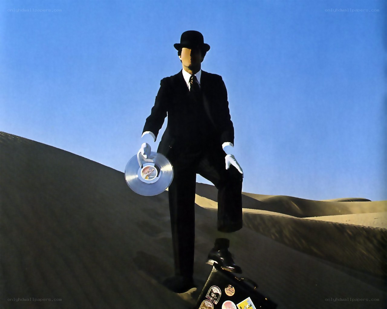 Man in suit holding record