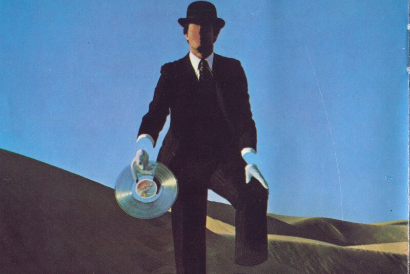 Man in Suit Holding Record — Blue