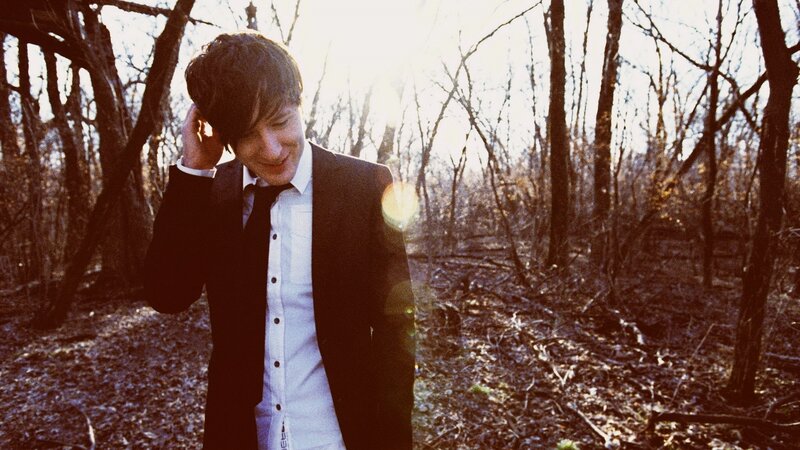 man in suit in forest