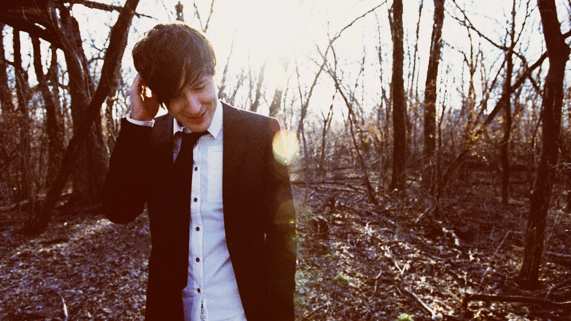 man in suit in forest