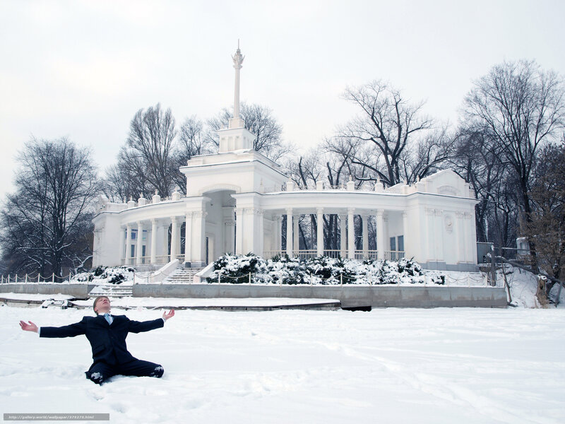 Man in suit in snowy park