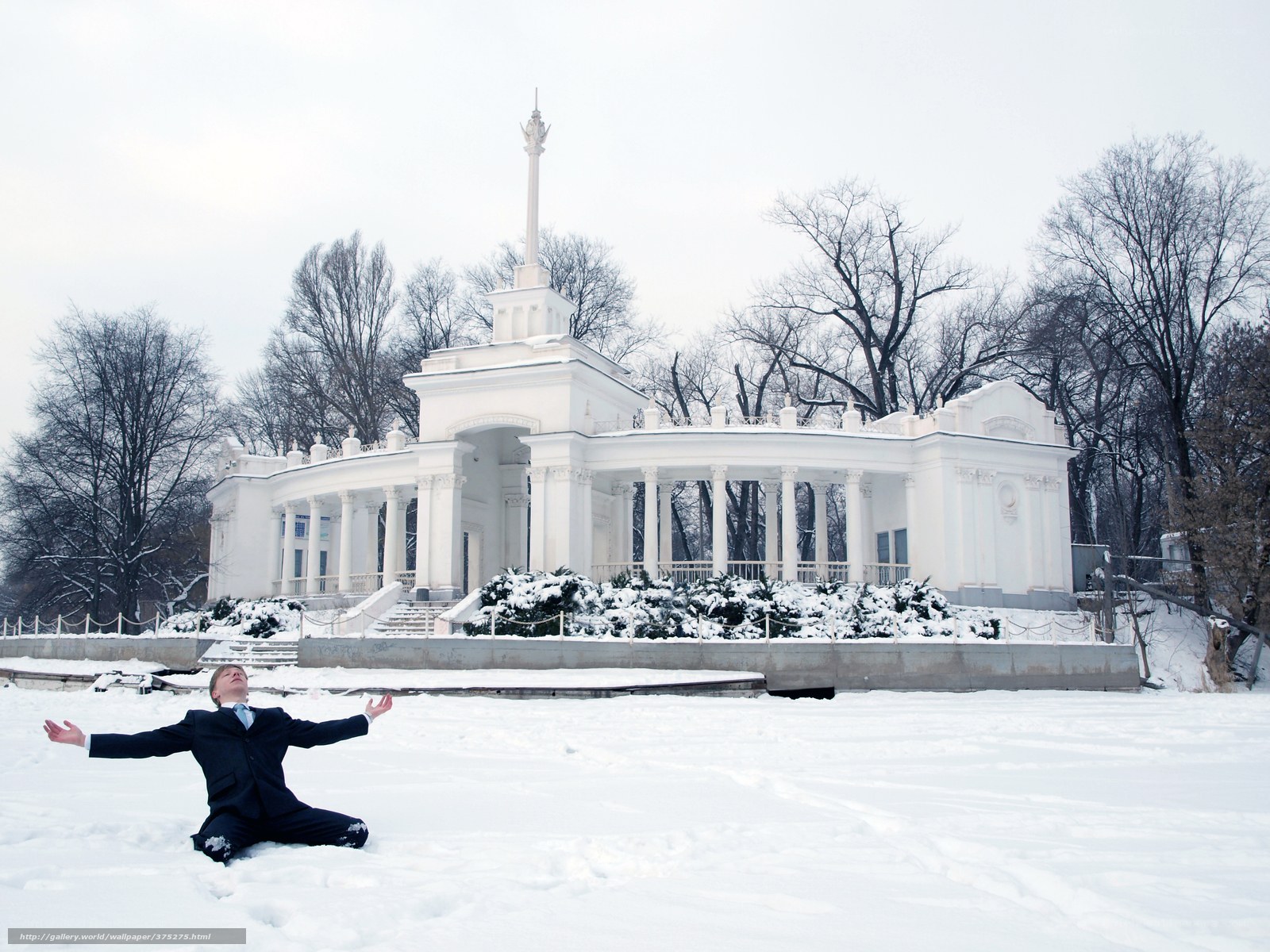 Man in suit in snowy park