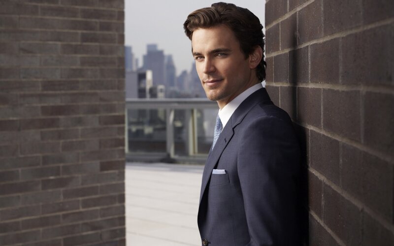 Man in Suit Leaning