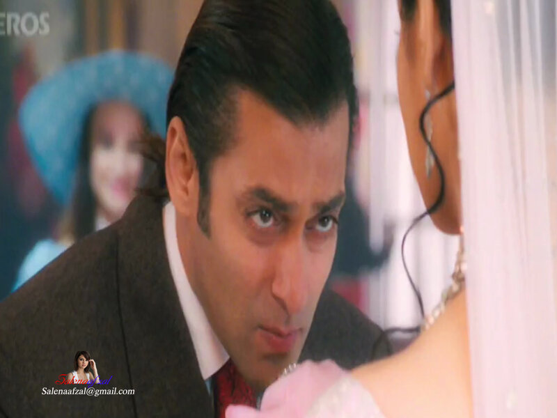 man in suit looking at woman