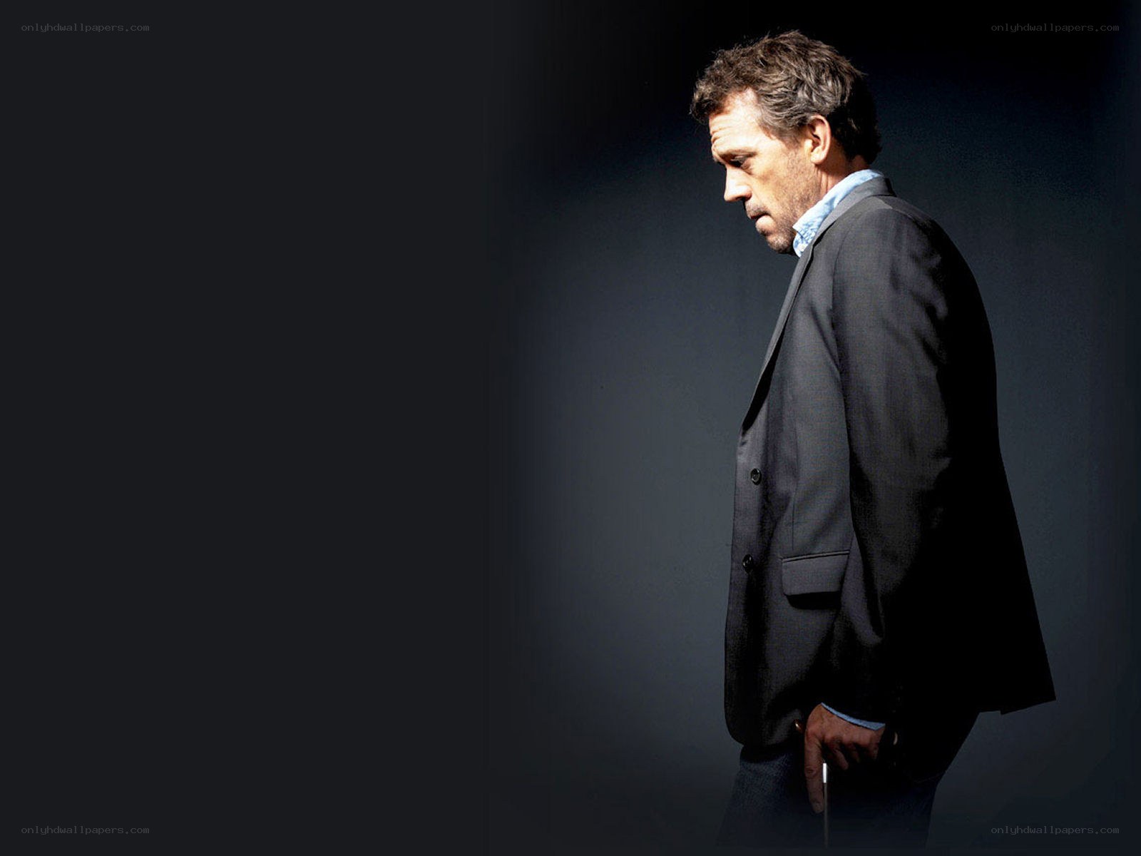 man in suit looking down