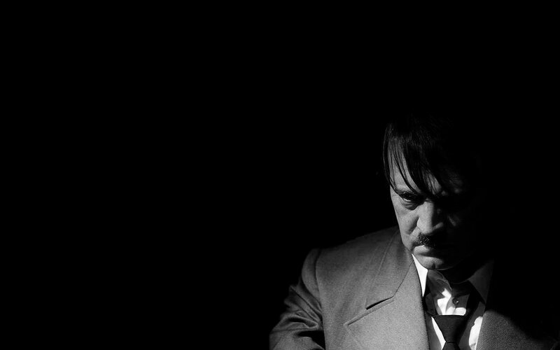 Man in Suit Looking Down — Black, Dramatic