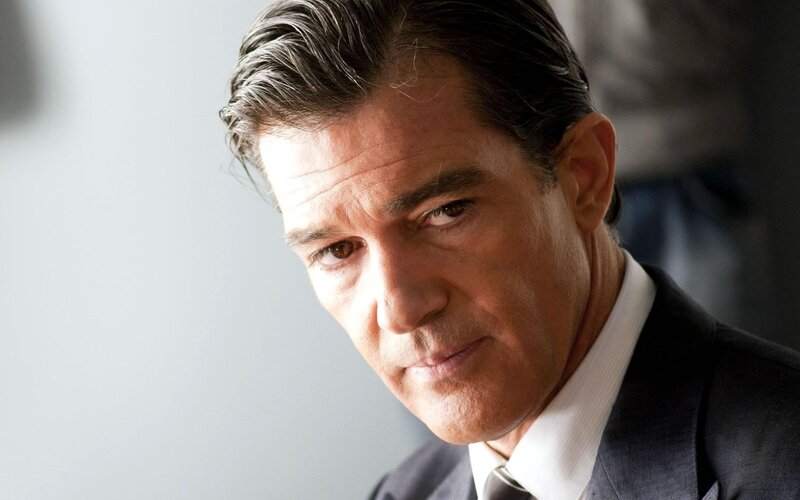 Man in Suit Looking Down — Gray, Serious