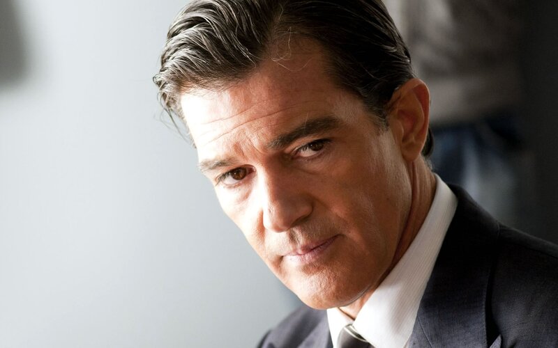 Man in Suit Looking Down — Gray