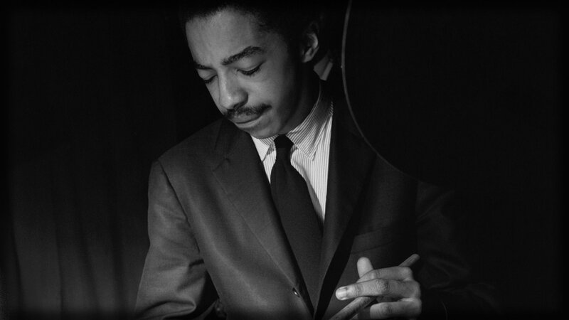 man in suit looking down
