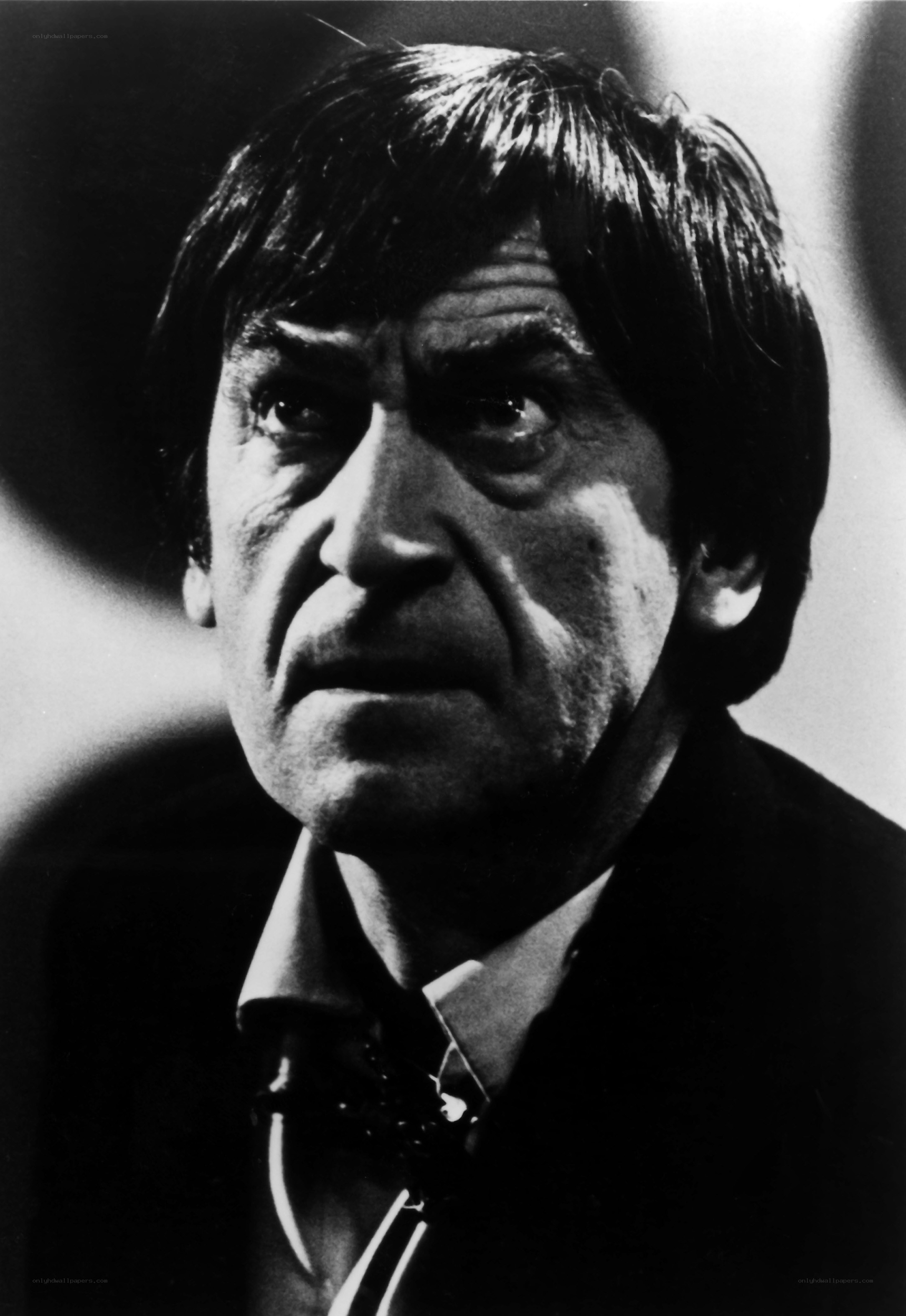 man in suit looking up