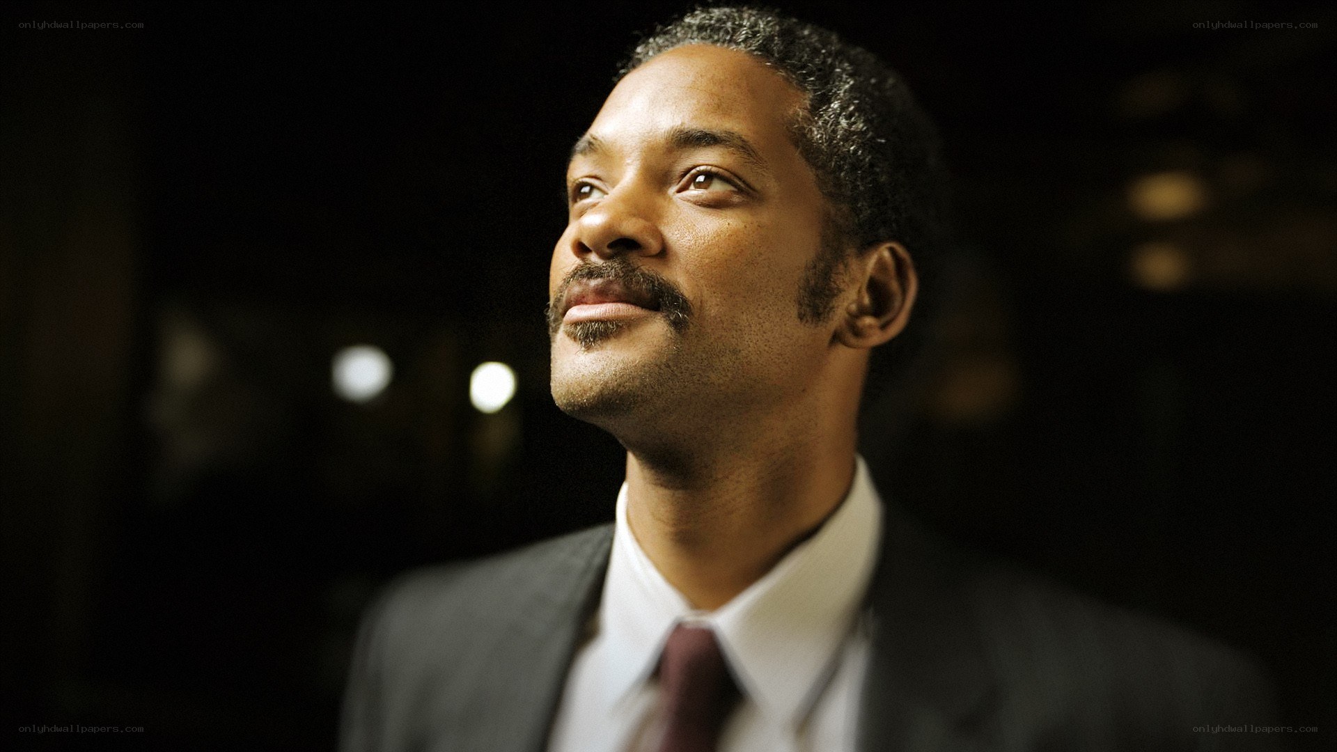 man in suit looking up