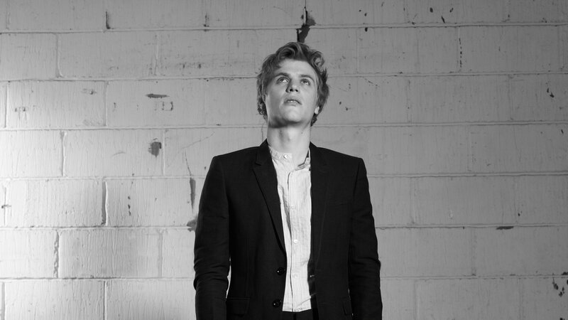 man in suit looking up
