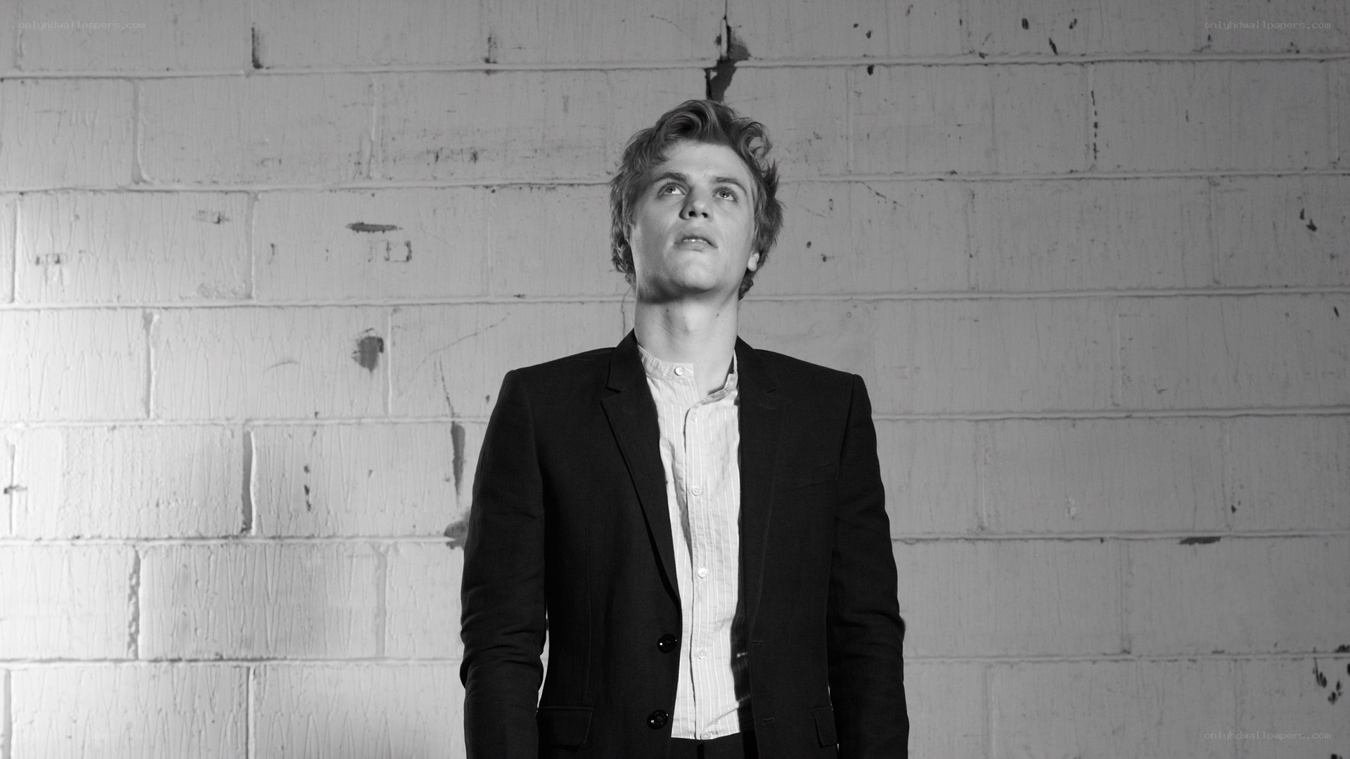 man in suit looking up