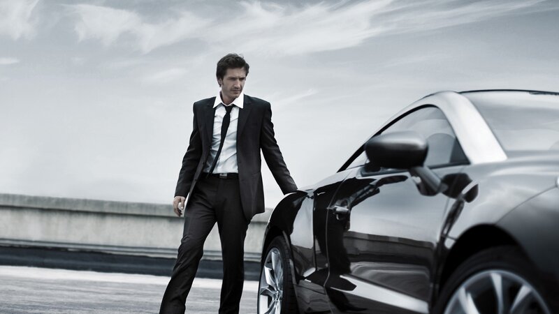 Man in Suit Next to Car