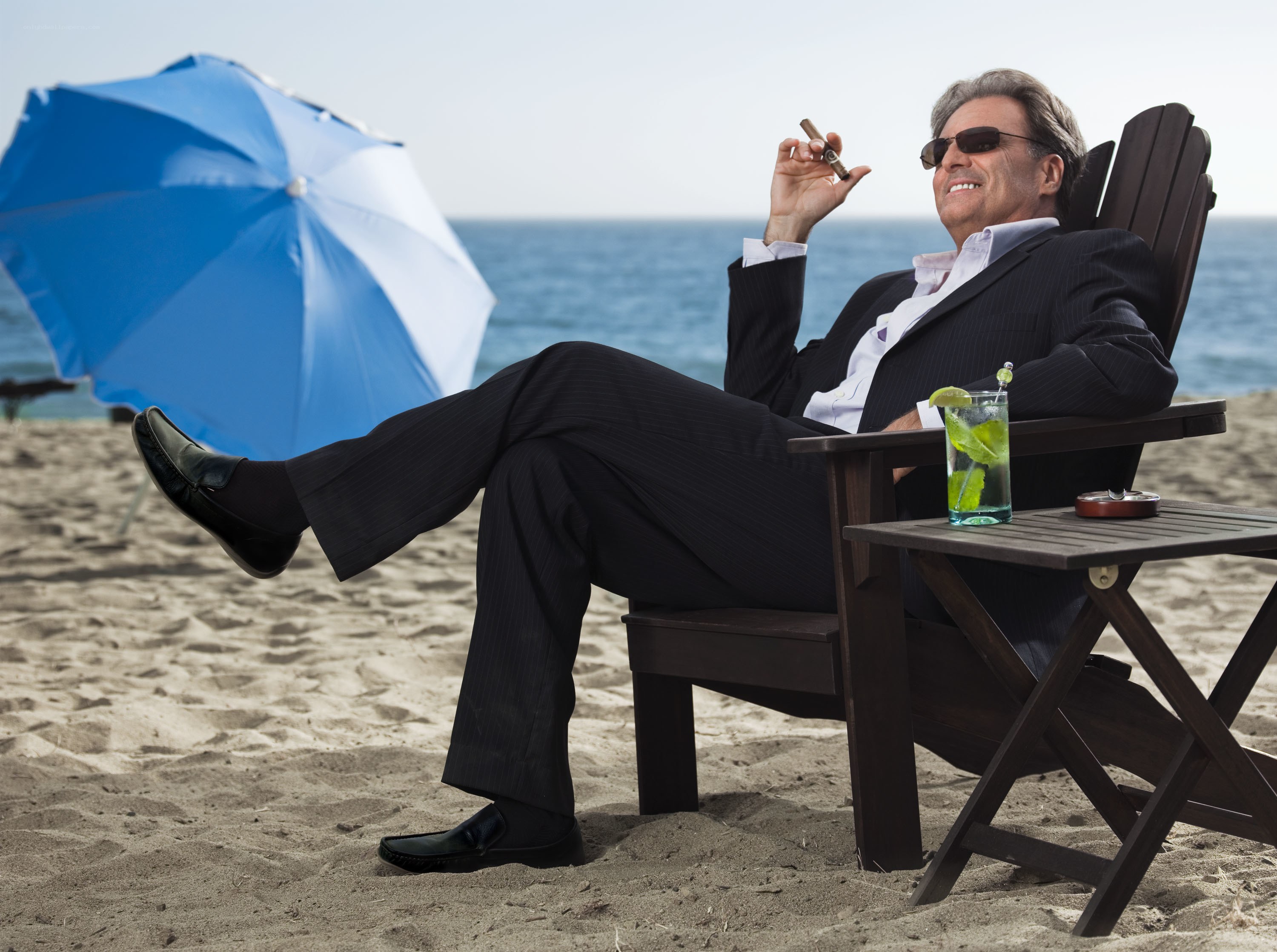 Man in suit on beach
