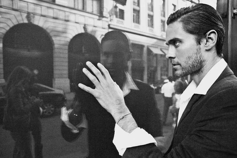 man in suit on city street